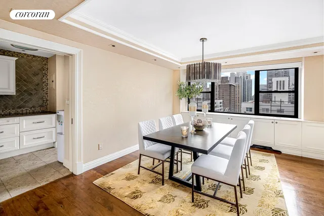 a view of a livingroom with furniture and a ceiling fan
