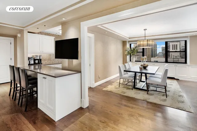 a view of a dining room with furniture window and wooden floor