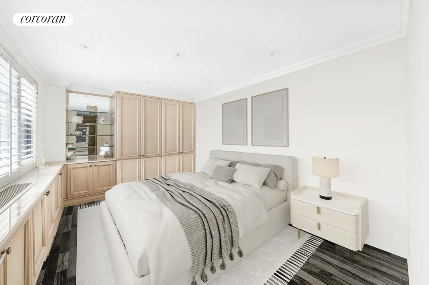 233 East 69th Street, Unit 14K Manhattan, NY 10021 - Photo 8 of 12 a bedroom with a large bed and a window