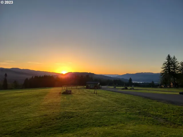 a view of an ocean beach and mountain