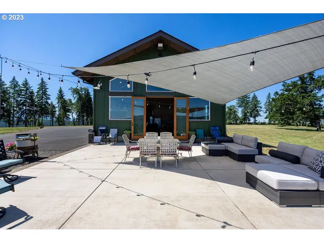 a view of a patio with couches and a fire pit
