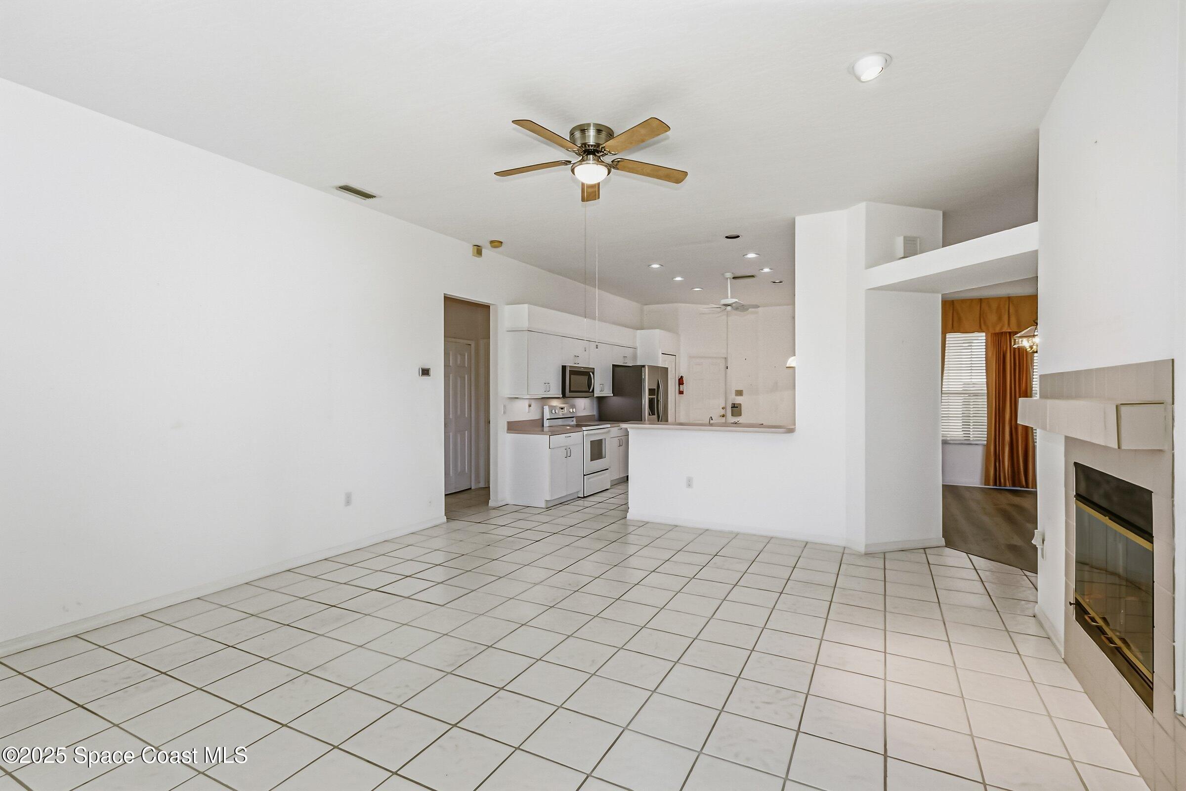 4048 Sand Ridge Drive Merritt Island, FL 32953 - Photo 15 of 70 a view of a kitchen with a sink dishwasher and a refrigerator