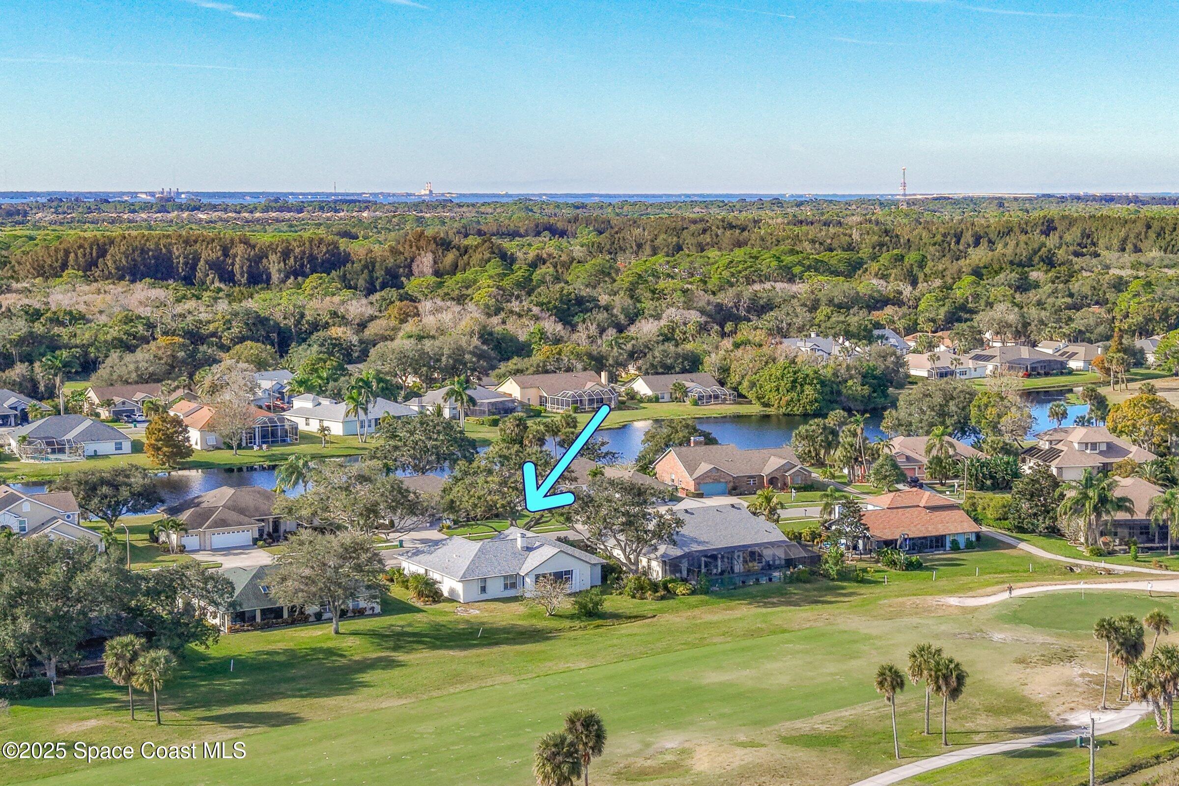 4048 Sand Ridge Drive Merritt Island, FL 32953 - Photo 2 of 70 an aerial view of residential houses with outdoor space and swimming pool