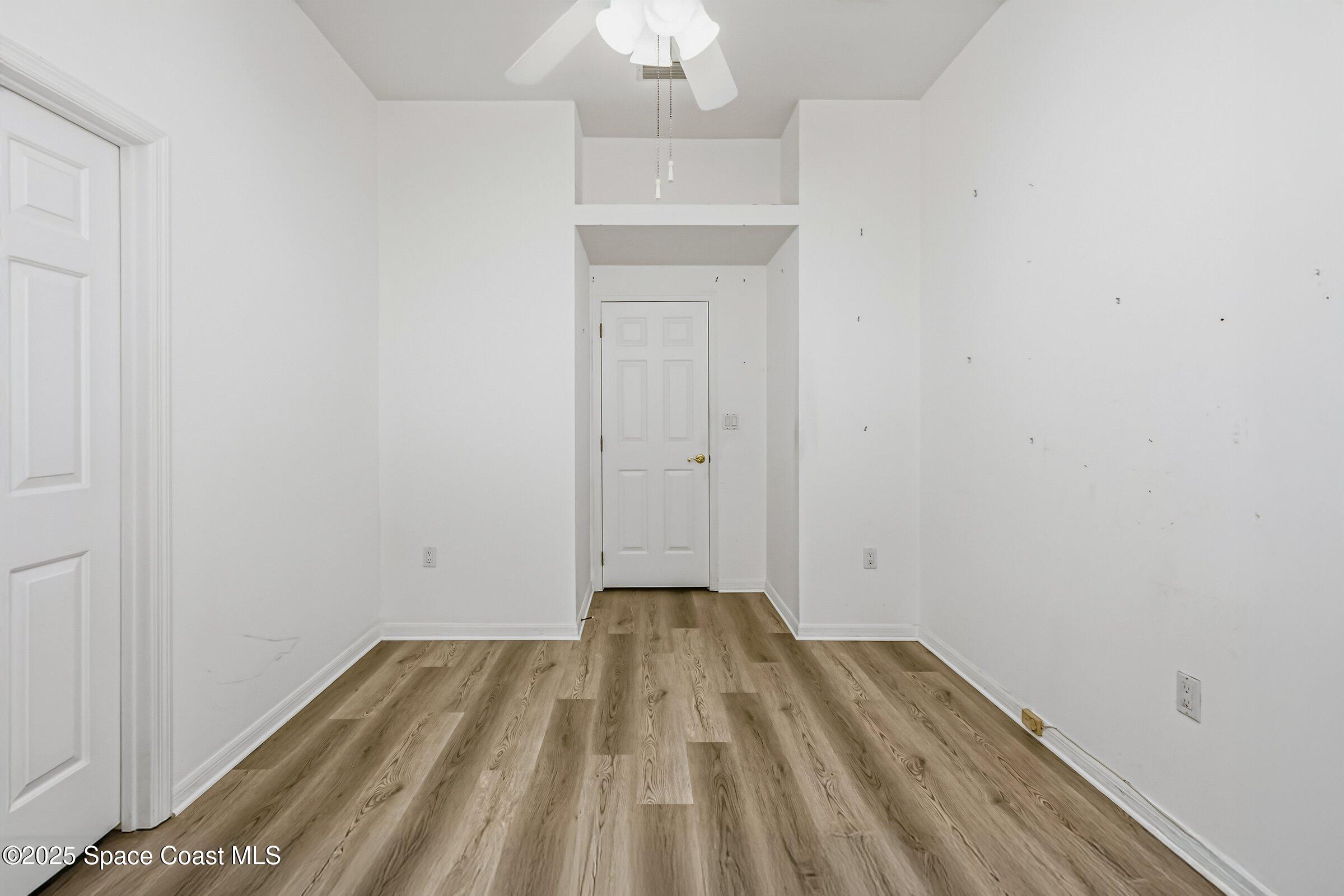4048 Sand Ridge Drive Merritt Island, FL 32953 - Photo 32 of 70 a view of a room with wooden floor and a sink