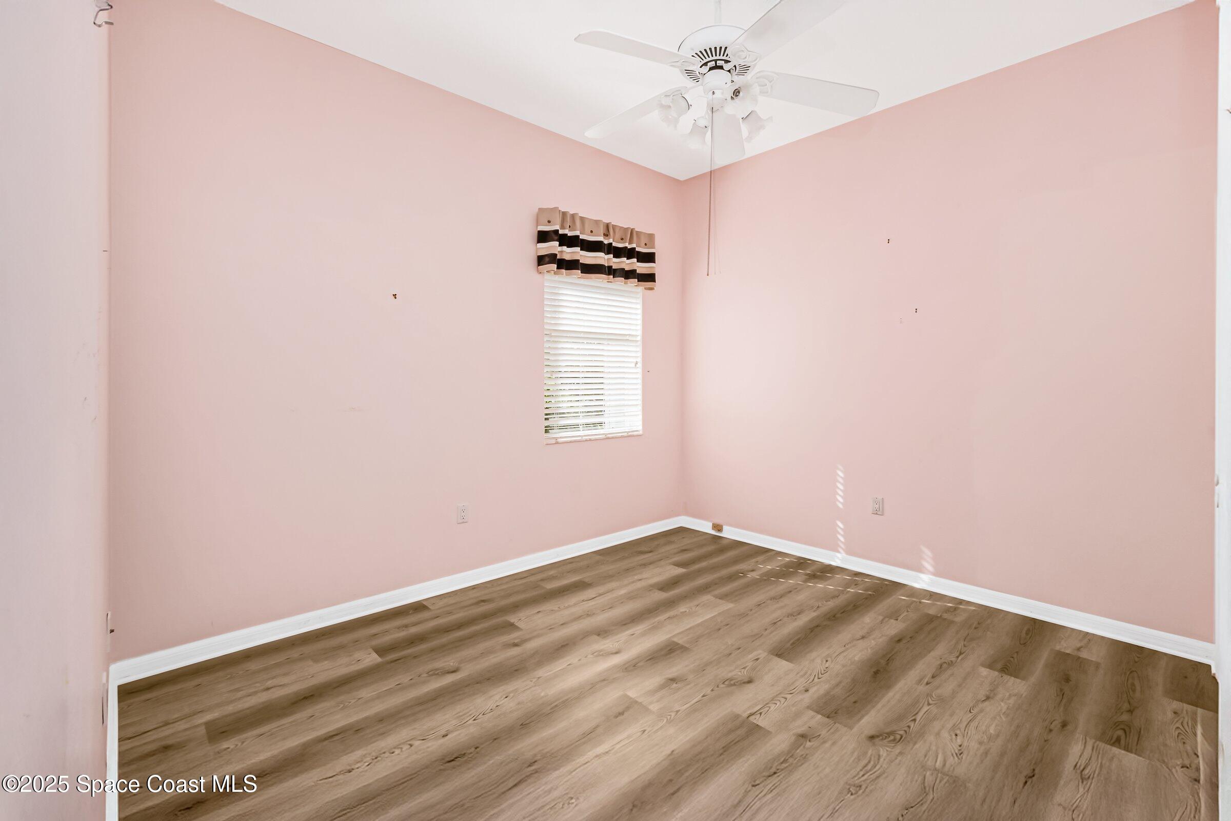 4048 Sand Ridge Drive Merritt Island, FL 32953 - Photo 37 of 70 an empty room with windows and fan