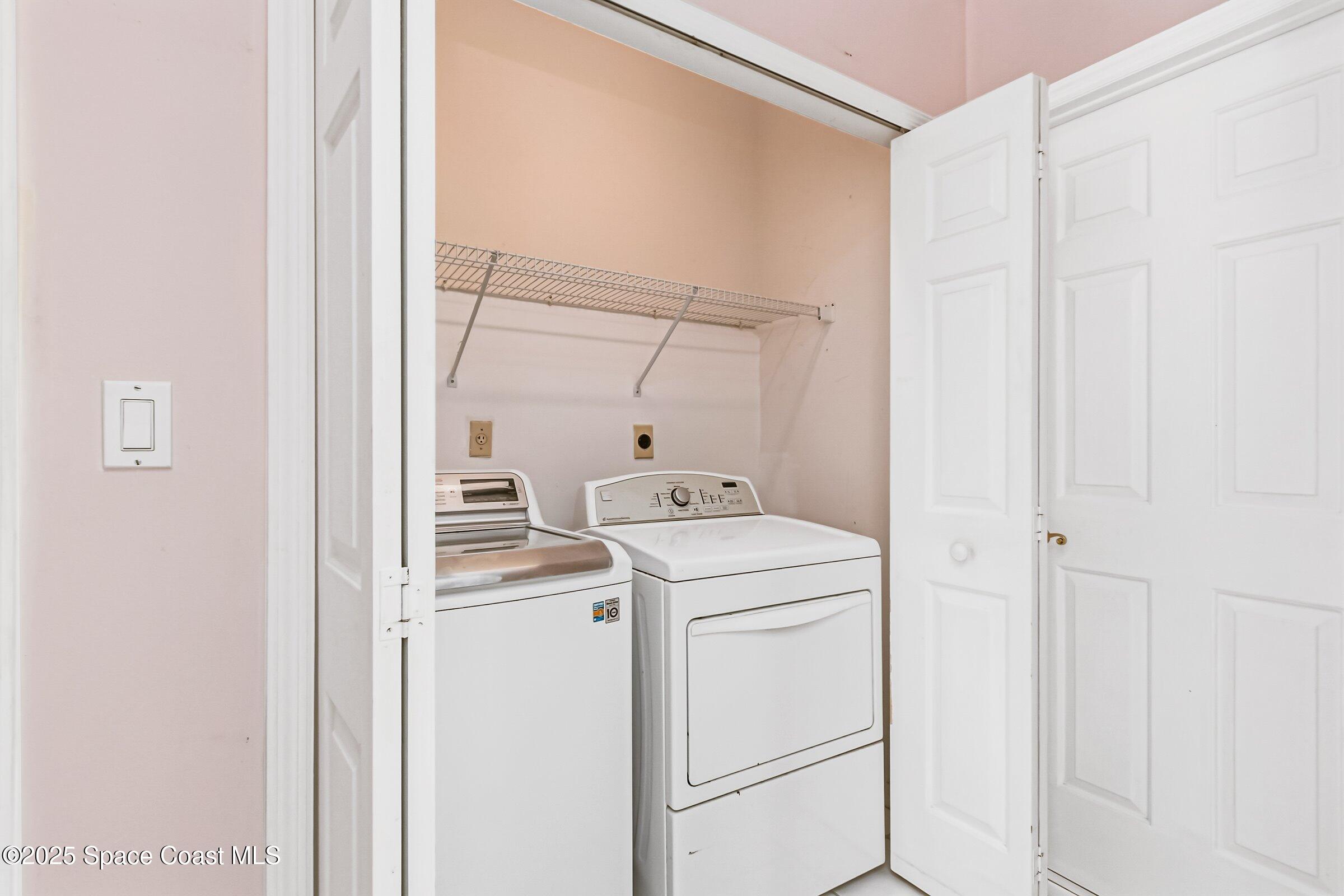 4048 Sand Ridge Drive Merritt Island, FL 32953 - Photo 38 of 70 a utility room with dryer and washer