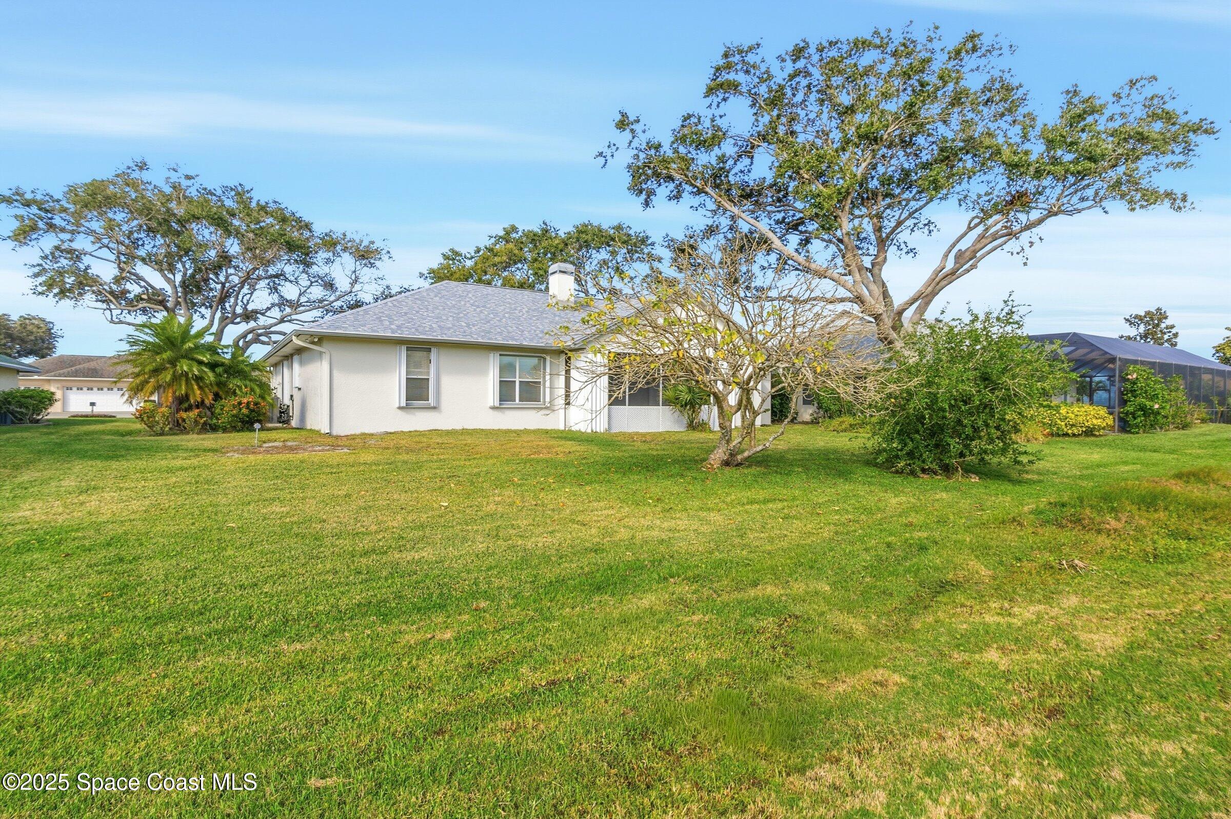 4048 Sand Ridge Drive Merritt Island, FL 32953 - Photo 4 of 70 a view of a house with a yard