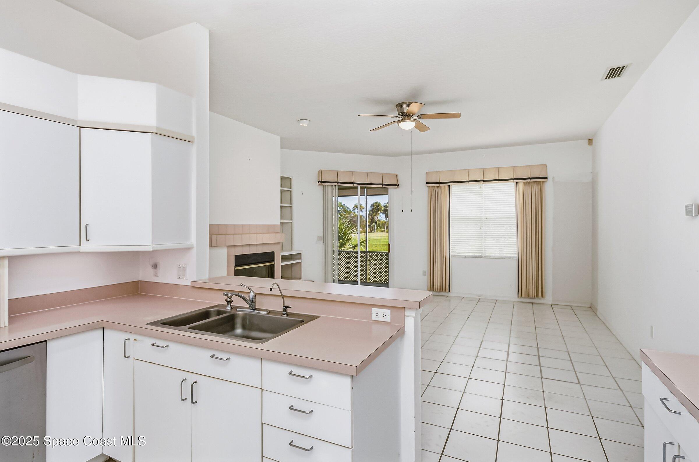 4048 Sand Ridge Drive Merritt Island, FL 32953 - Photo 43 of 70 a kitchen with a sink cabinets and window