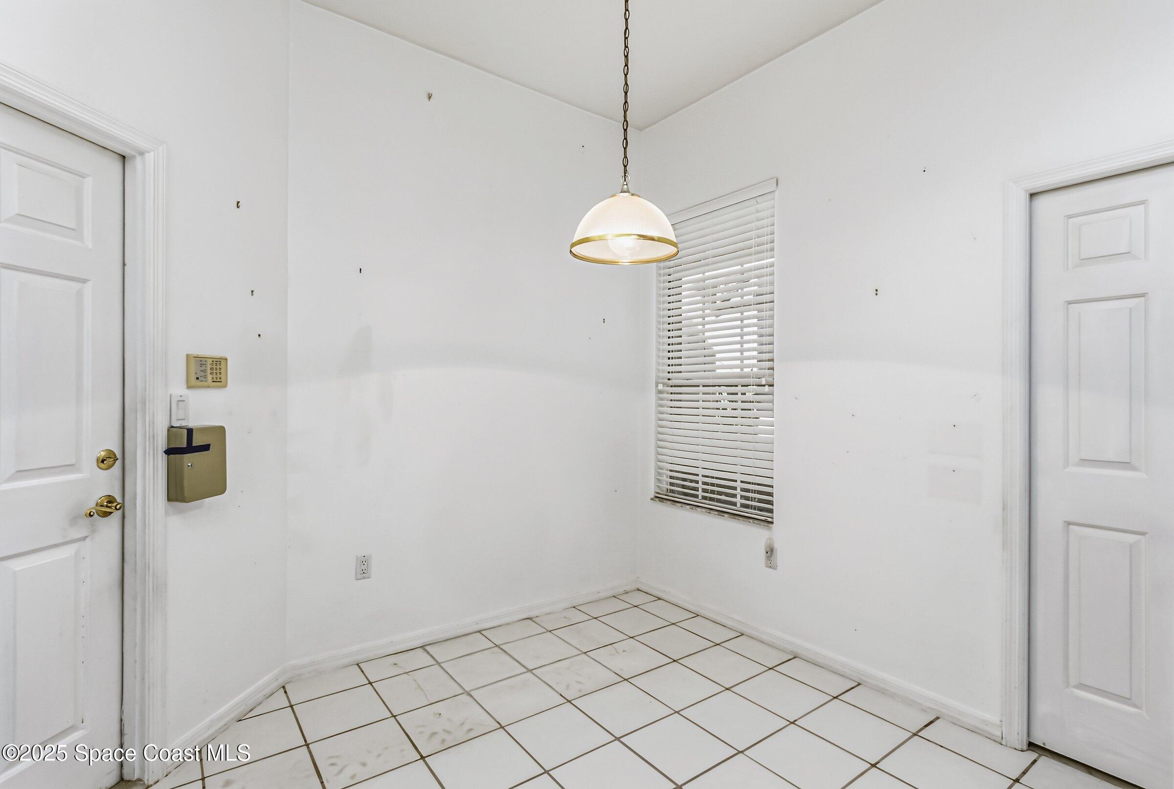 4048 Sand Ridge Drive Merritt Island, FL 32953 - Photo 45 of 70 a view of an empty room with a window