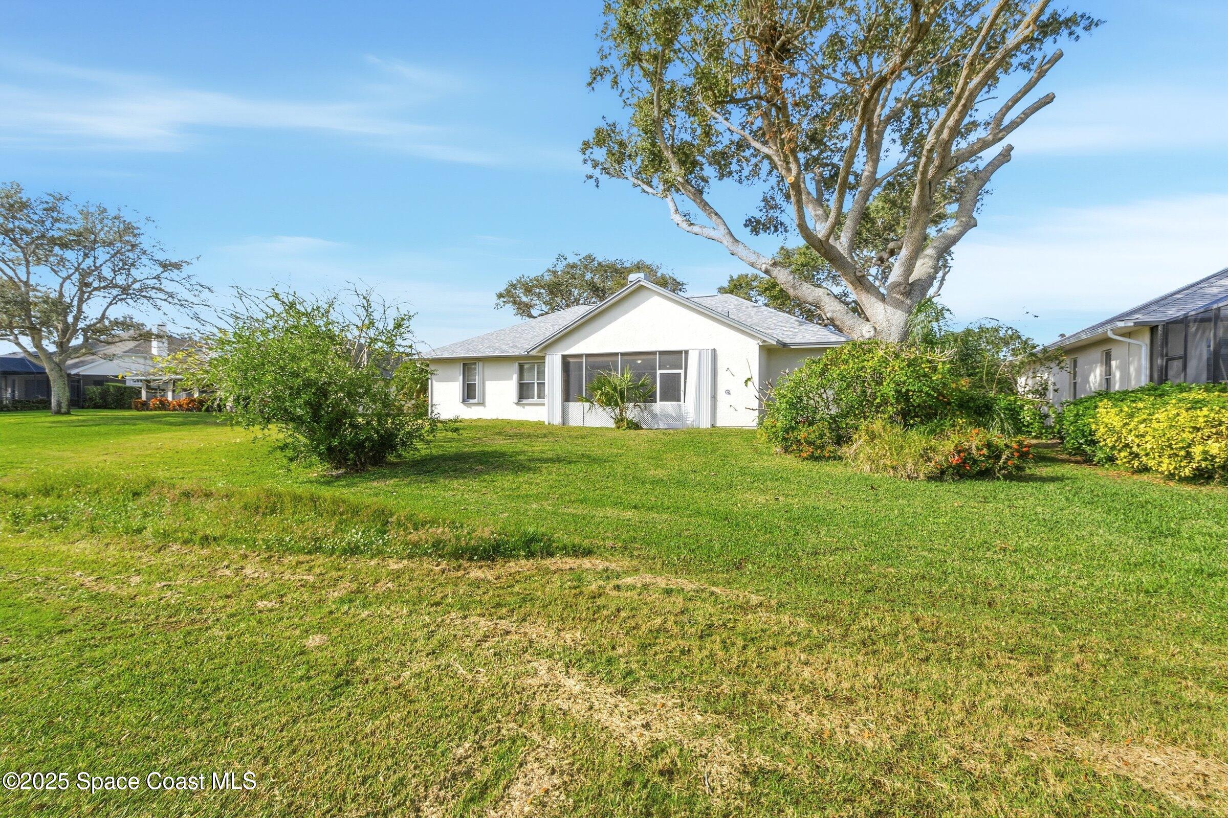 4048 Sand Ridge Drive Merritt Island, FL 32953 - Photo 50 of 70 a front view of house with yard and green space