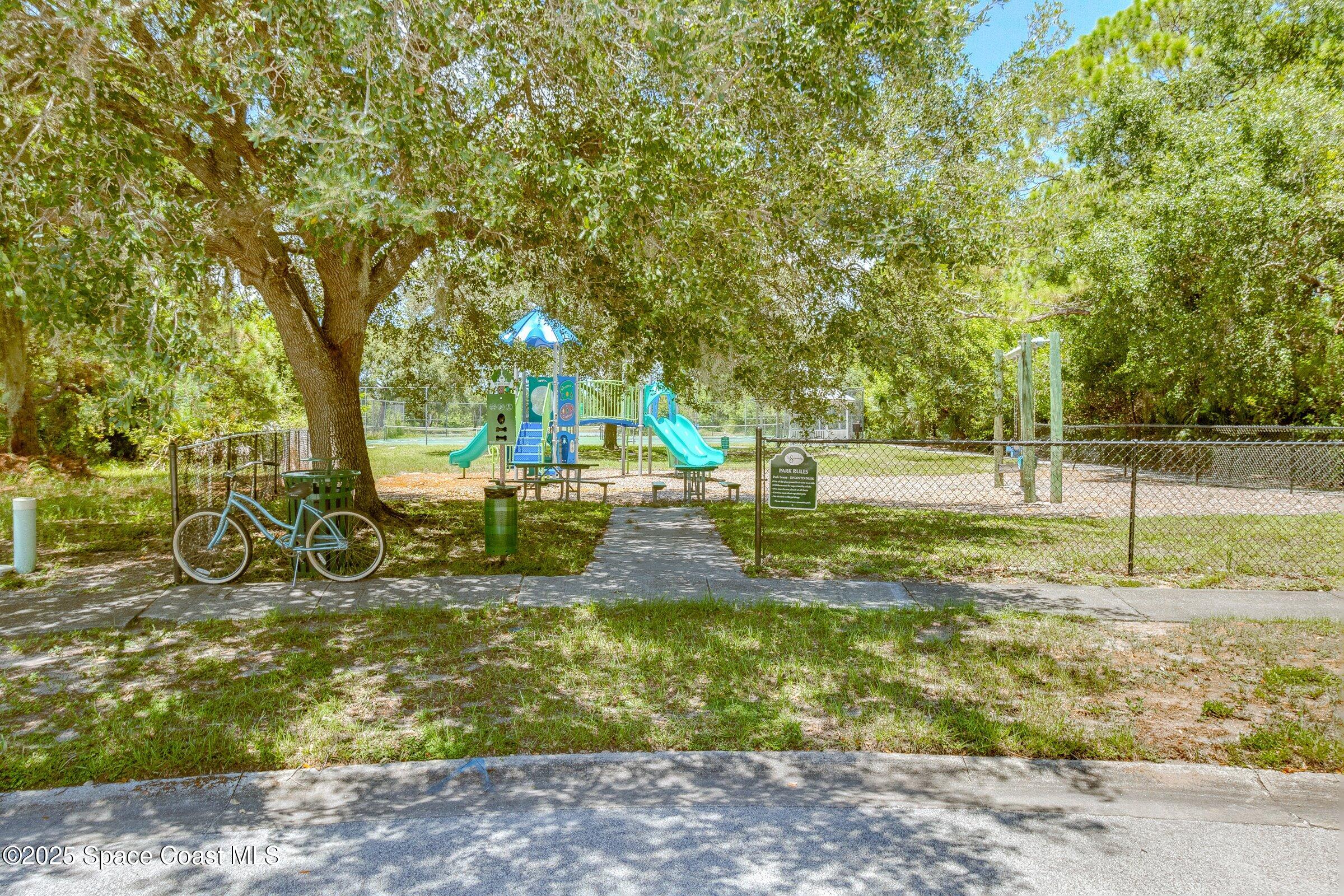 4048 Sand Ridge Drive Merritt Island, FL 32953 - Photo 52 of 70 a view of a yard with swimming pool