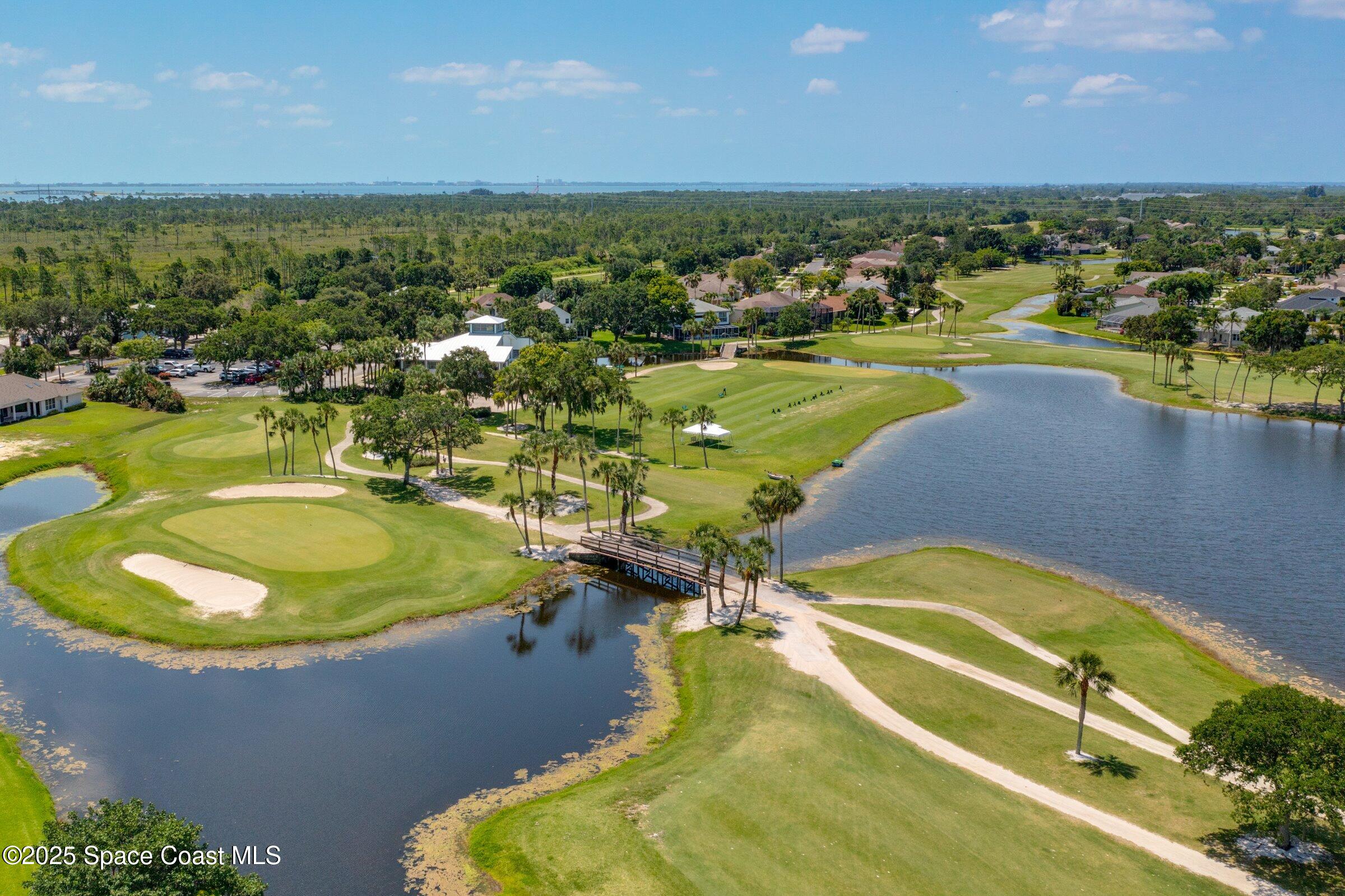 4048 Sand Ridge Drive Merritt Island, FL 32953 - Photo 55 of 70 a view of a swimming pool with a table and chairs