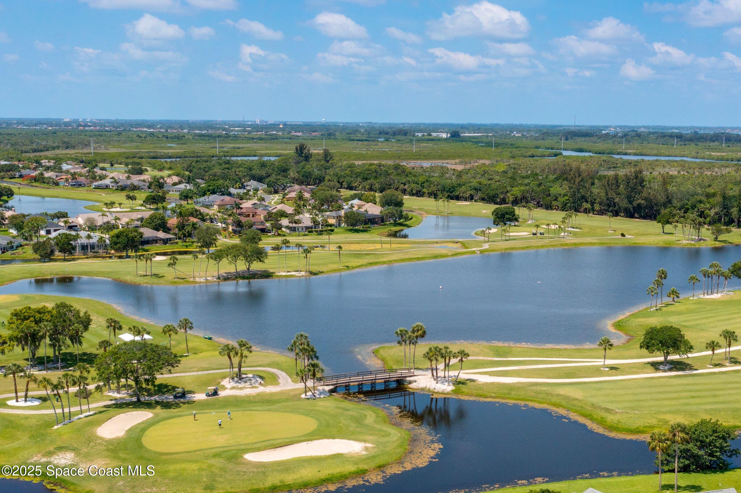 4048 Sand Ridge Drive Merritt Island, FL 32953 - Photo 57 of 70 a view of a lake with a mountain in the background