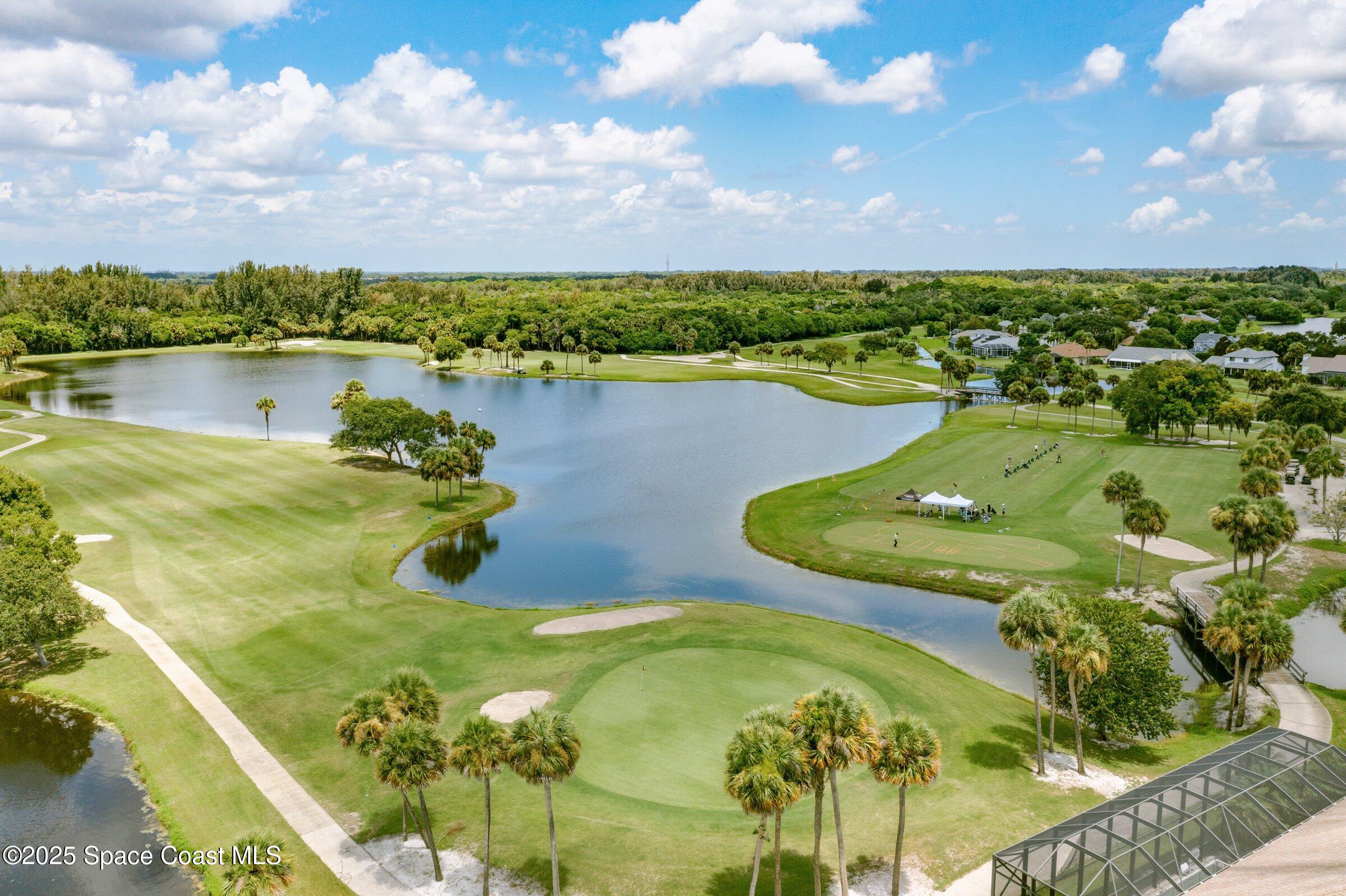 4048 Sand Ridge Drive Merritt Island, FL 32953 - Photo 61 of 70 a view of a lake with a city