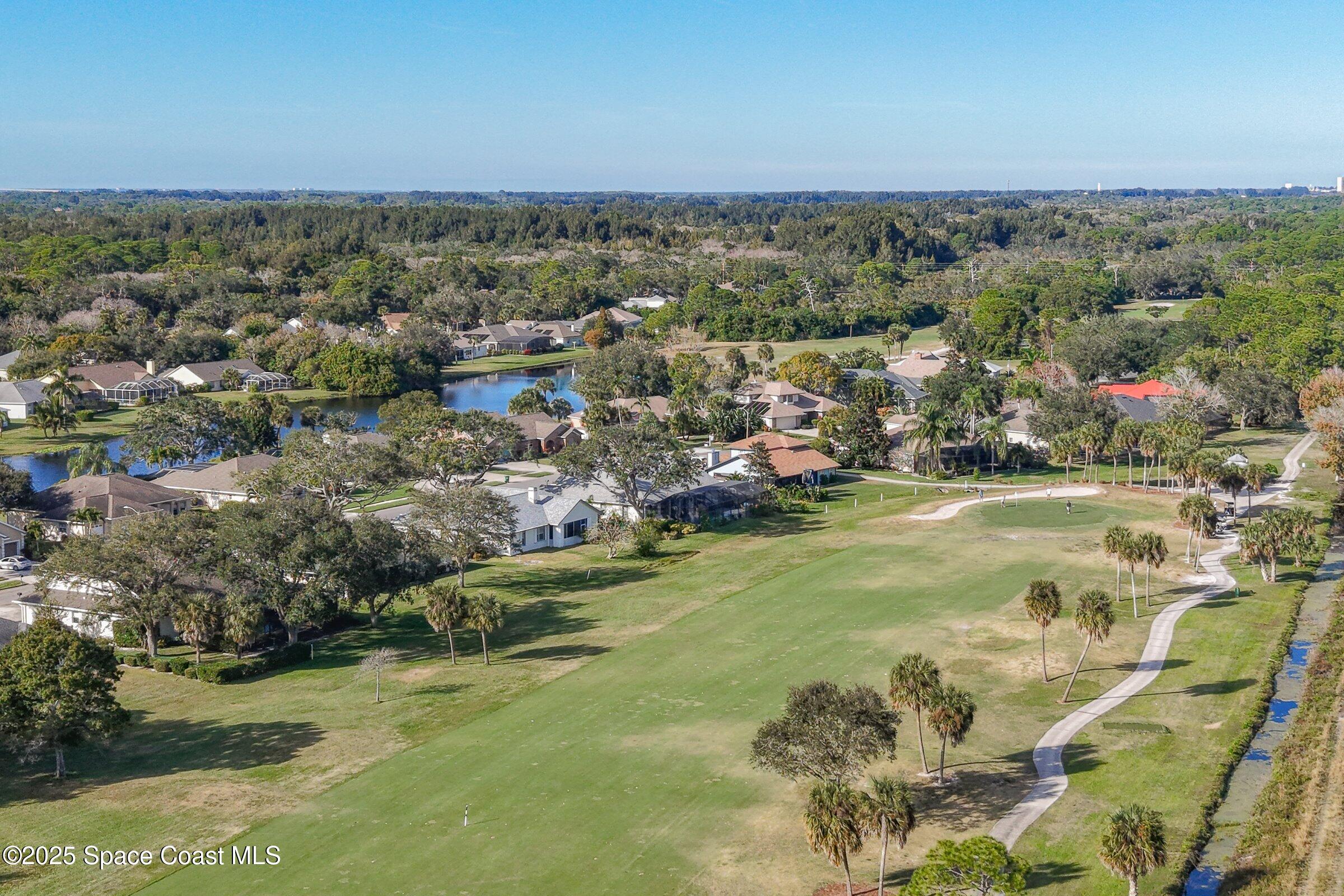 4048 Sand Ridge Drive Merritt Island, FL 32953 - Photo 68 of 70 a view of a town with mountains in the background