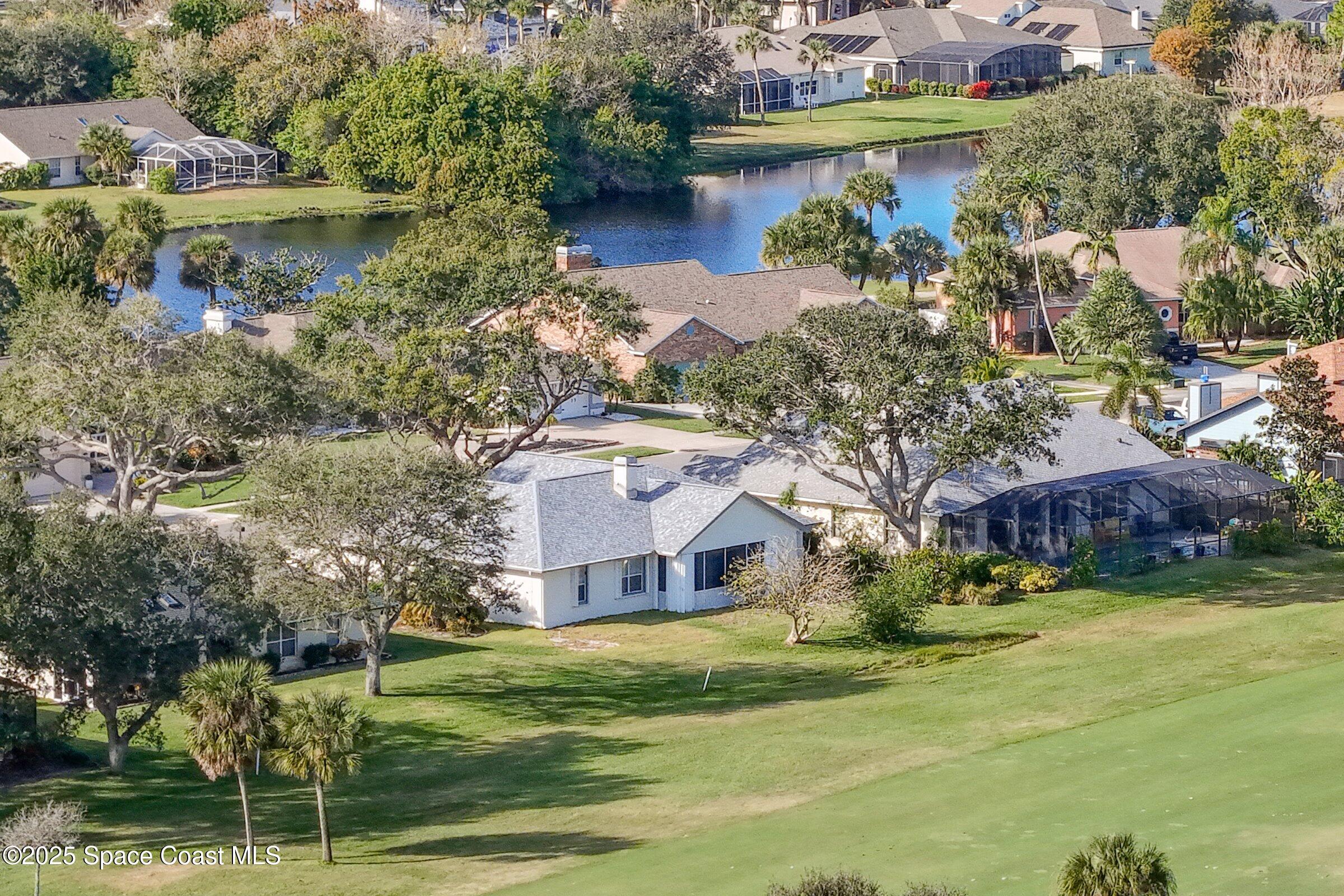 4048 Sand Ridge Drive Merritt Island, FL 32953 - Photo 69 of 70 an aerial view of a house with a yard basket ball court and outdoor seating