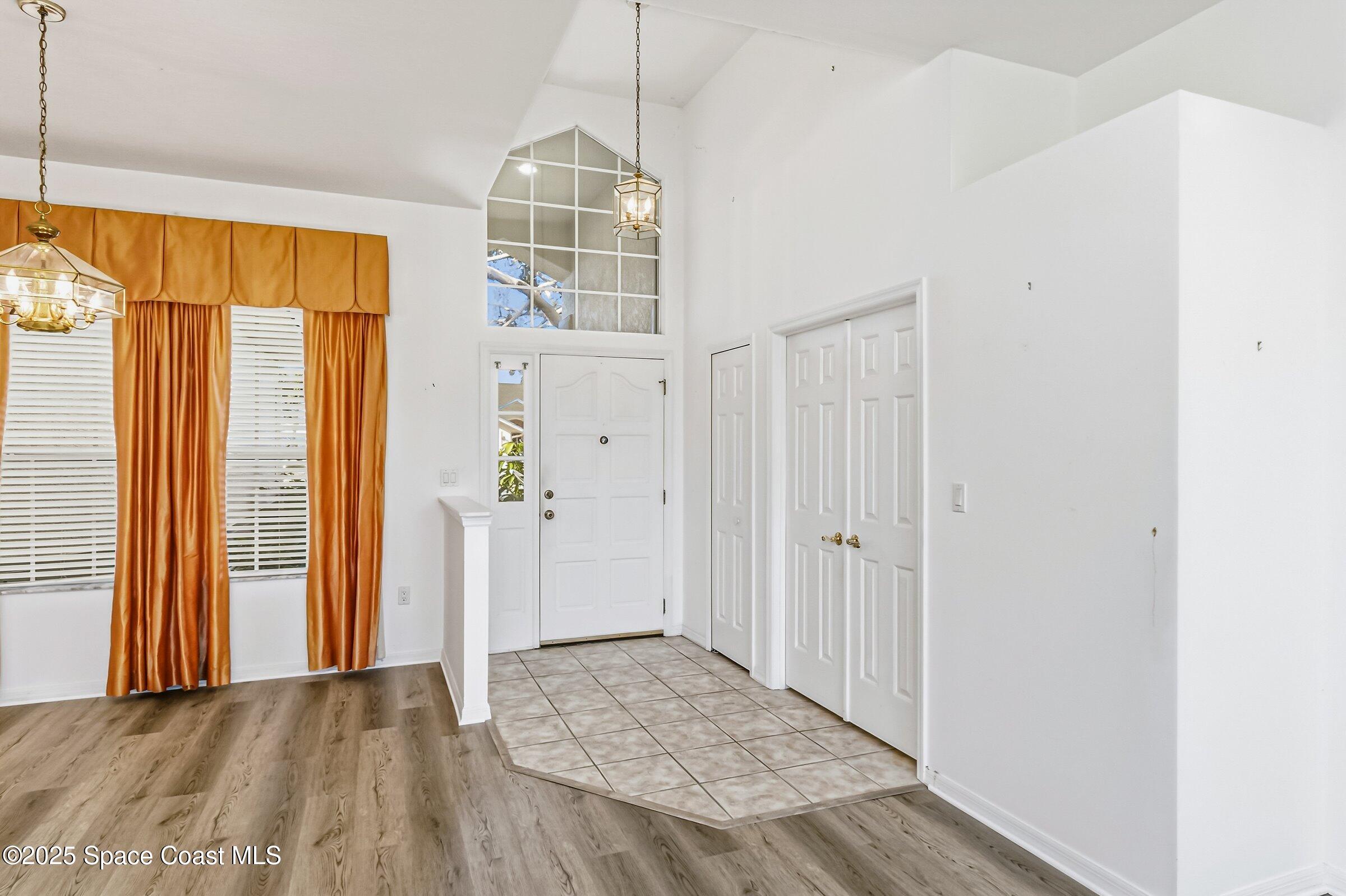 4048 Sand Ridge Drive Merritt Island, FL 32953 - Photo 9 of 70 a view of empty room with wooden floor and fan