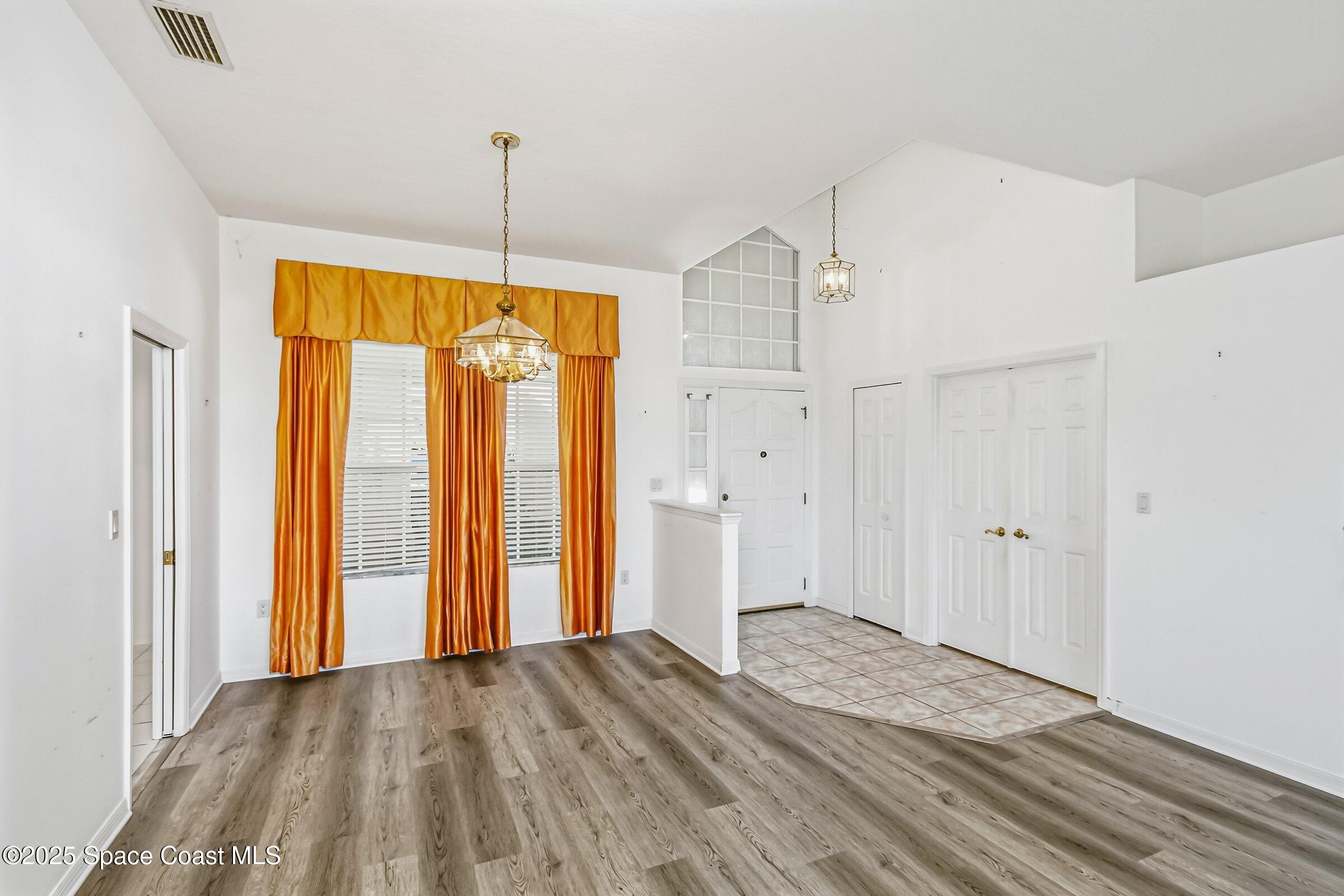 4048 Sand Ridge Drive Merritt Island, FL 32953 - Photo 10 of 70 a view of empty room with wooden floor and fan