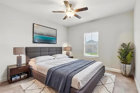 a bedroom with bed and window