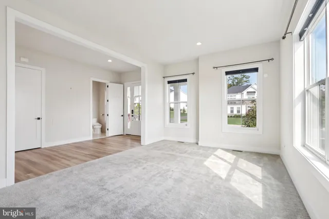 a kitchen with stainless steel appliances granite countertop a sink a stove and a wooden floors