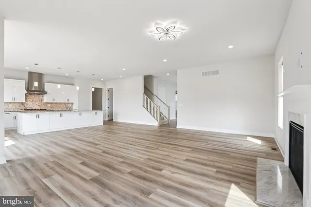 a bathroom with a toilet a sink and a mirror