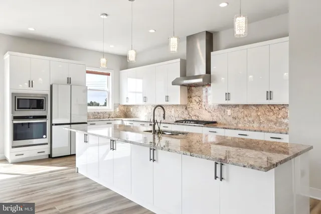 a bedroom with a large bed and a flat screen tv