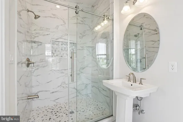 an empty room with a ceiling fan and a window