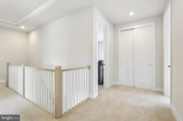 a bathroom with a sink a light fixture and a mirror