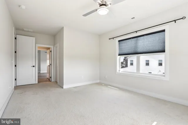 a bathroom with a sink a toilet a mirror and shower