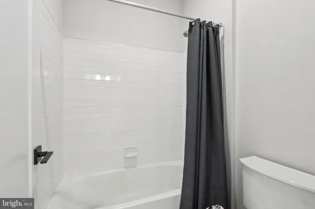 an aerial view of a house with a garden and lake view