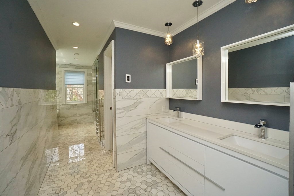 725 Chestnut Street Newton, MA 02468 - Photo 17 of 42 a bathroom with a double vanity sink mirror and shower