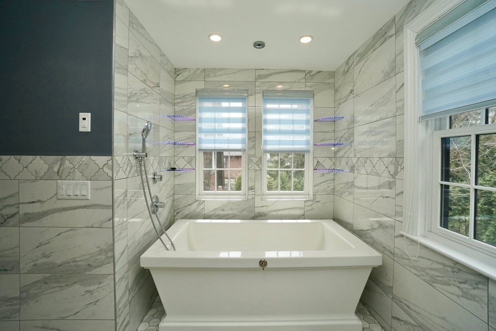 725 Chestnut Street Newton, MA 02468 - Photo 19 of 42 a bath tub sitting in a bathroom next to a window