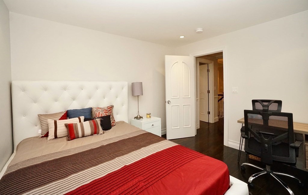 725 Chestnut Street Newton, MA 02468 - Photo 26 of 42 a bedroom with a bed and wooden floor