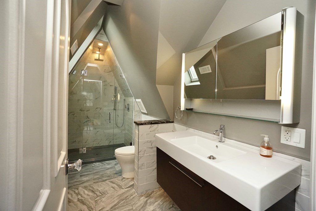 725 Chestnut Street Newton, MA 02468 - Photo 31 of 42 a bathroom with a sink mirror and a toilet