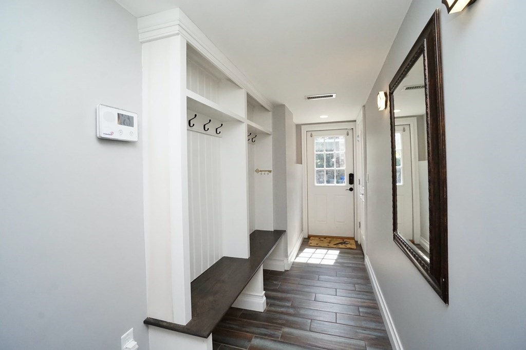 725 Chestnut Street Newton, MA 02468 - Photo 33 of 42 a view of a hallway with wooden floor and staircase