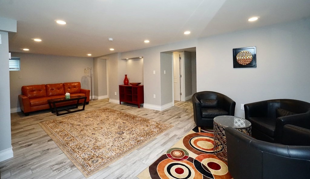 725 Chestnut Street Newton, MA 02468 - Photo 34 of 42 a living room with furniture and a couch