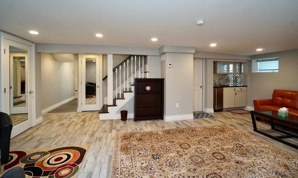 725 Chestnut Street Newton, MA 02468 - Photo 35 of 42 a living room with stainless steel appliances kitchen island granite countertop furniture and a refrigerator