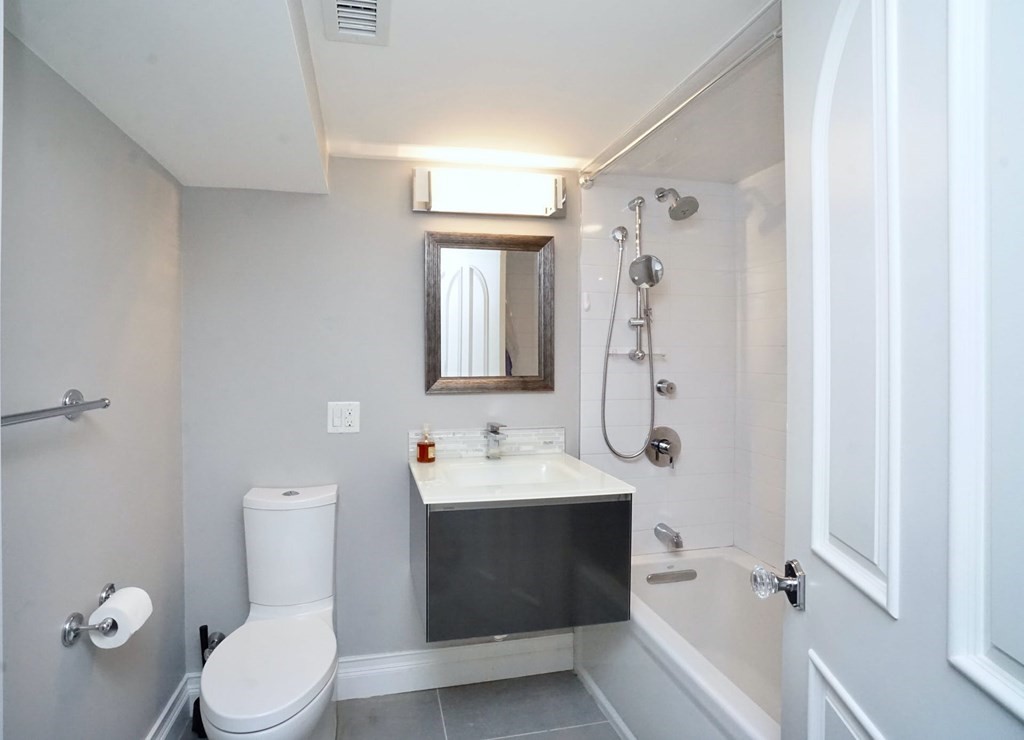 725 Chestnut Street Newton, MA 02468 - Photo 37 of 42 a bathroom with a sink toilet and shower