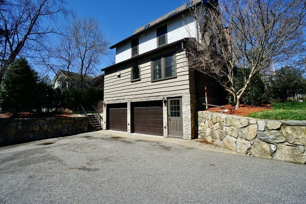 725 Chestnut Street Newton, MA 02468 - Photo 41 of 42 a view of house with outdoor space and parking