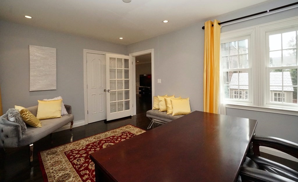 725 Chestnut Street Newton, MA 02468 - Photo 10 of 42 a bedroom with a bed and wooden floor