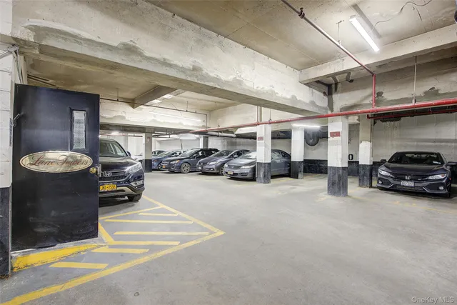 a view of parking garage with cars