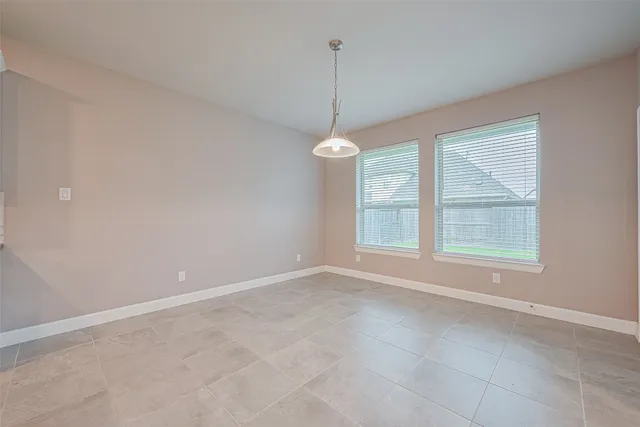 a large kitchen with kitchen island a large counter top space a sink stainless steel appliances and cabinets