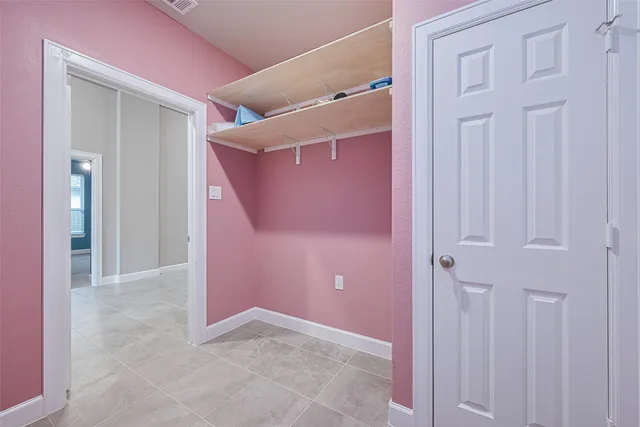 a view of a livingroom with a ceiling fan and window