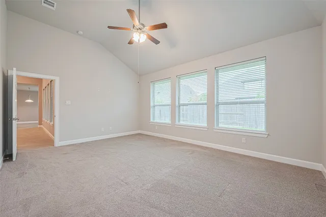 a bathroom with a granite countertop sink a bathtub a mirror and vanity