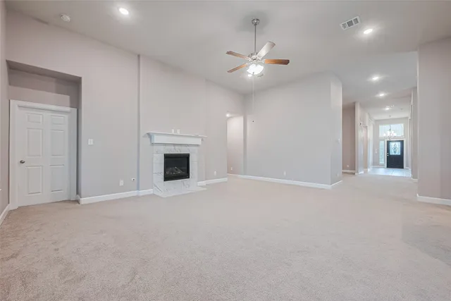 a view of an empty room with a fireplace