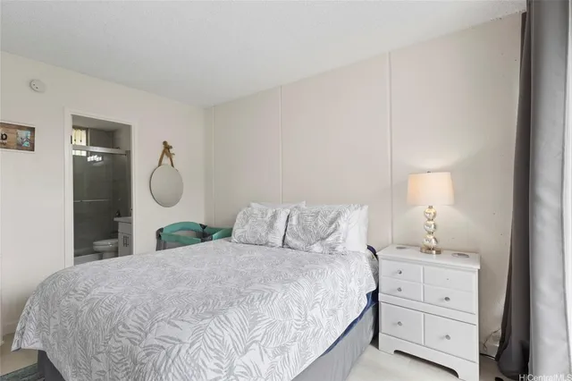 a bedroom with a bed and a mirror