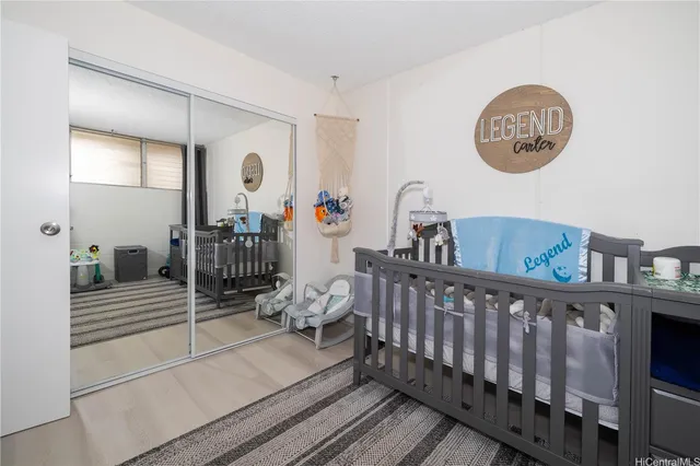 a bedroom with furniture and a window