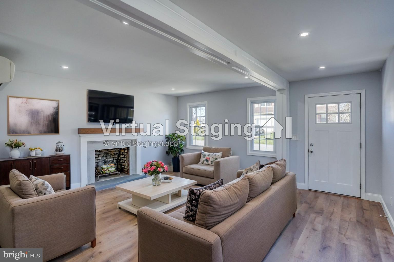 613 Taylor Street Townsend, DE 19734 - Photo 11 of 36 a living room with furniture a fireplace and a flat screen tv