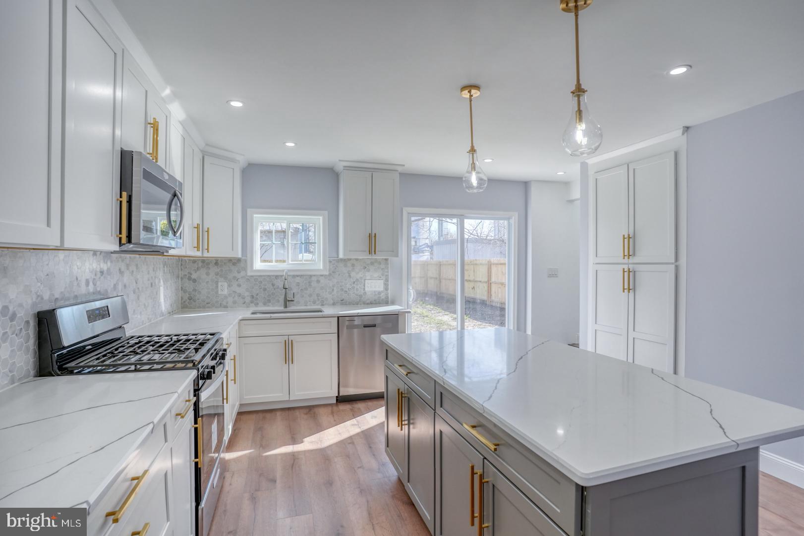 613 Taylor Street Townsend, DE 19734 - Photo 18 of 36 a kitchen with a sink appliances and cabinets