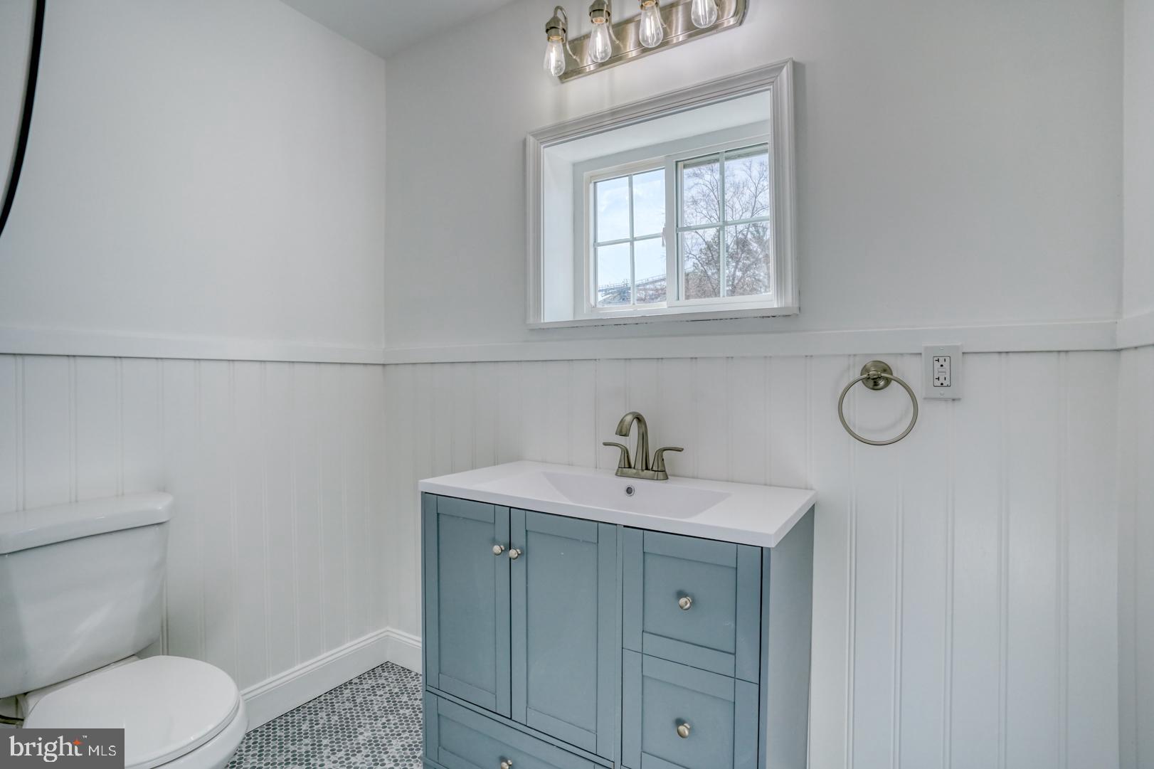 613 Taylor Street Townsend, DE 19734 - Photo 20 of 36 a bathroom with a toilet sink and mirror